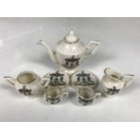 A child's crested china miniature tea set
