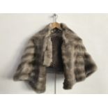 A vintage mink stole, with brown satin lining, together with one further mink collar with clip
