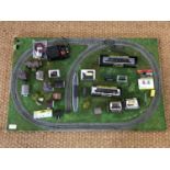 An N-gauge railway layout together with buildings and a Graham Farish V2 60800 Green Arrow