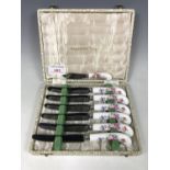 A cased set of six Royal Crown Derby Posies pattern pistol-grip tea knives, together with one