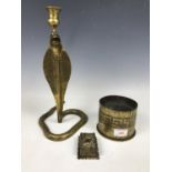 A large Indian brass cobra candlestick together with a wall mounted matchbox holder and a 1915 brass