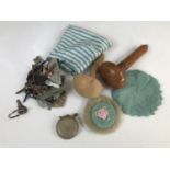 Collectors' items including a hand-crocheted powder puff, a coin purse, two darning mushrooms, and a