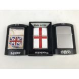 A Union Jack Zippo lighter together with two others