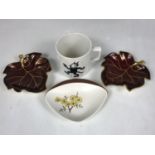 A Felix the Cat cup together with two Carlton ware Rouge Royale leaf dishes and a Carlton Ware dish