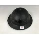 A 1941 British Civil Defence steel helmet