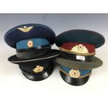 Four Cold War Soviet peaked caps