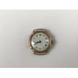 A lady's vintage 9ct gold cased wrist watch, having a white-enamelled dial, Roman numerals and a