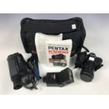 A Pentax camera together with a flash gun and a Sony Handycam video recorder etc.