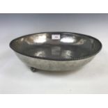 A Keswick School of Industrial Arts planished pewter bowl, having a rope-twist border, and three