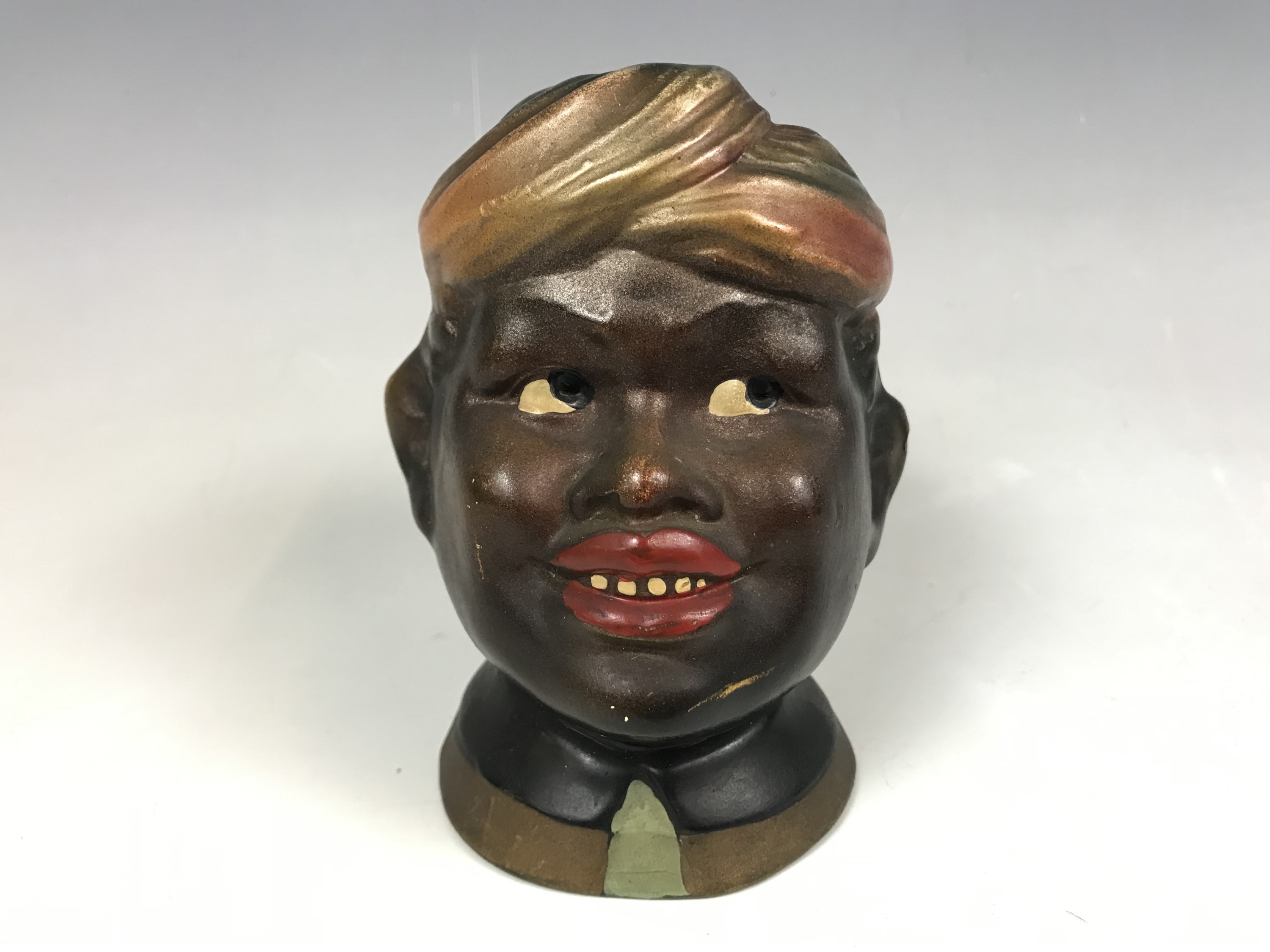 A 1930s painted plaster money box (a/f)