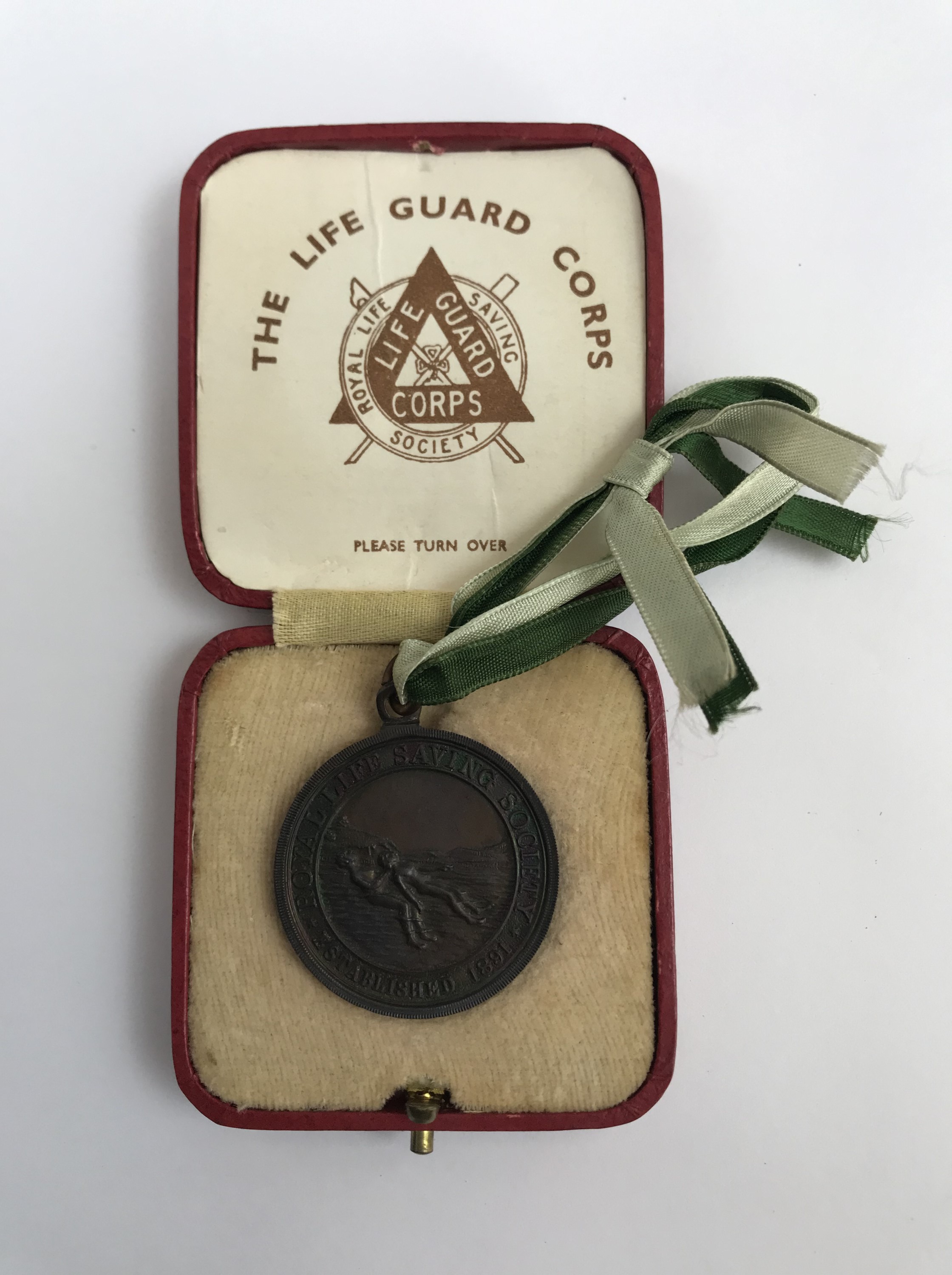 A cased Royal Life Saving Society bronze medal awarded to A R Taylor, July 1936