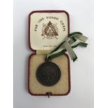 A cased Royal Life Saving Society bronze medal awarded to A R Taylor, July 1936