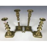 Two pairs of 19th Century brass candlesticks, 24 and 20 cm