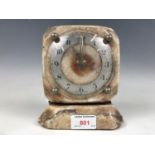 A polished mineral cased electric mantel clock