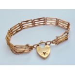 A late Victorian 9ct rose gold fancy gate-link bracelet with heart-shaped padlock clasp, 18.7g