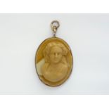 A lava cameo carved in depiction of a young lady with curled hair and veil, rub set in white-