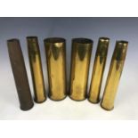 Four Second World War British Bofors artillery shell cases and two 25-pounder cases