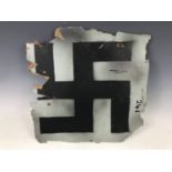 A fragment of plywood fuselage bearing a pained swastika and annotated verso ME 109, Wustorf,