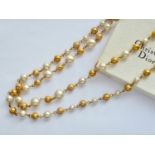 A Mitchel Maer for Bijou Christian Dior faux pearl and gilt-metal bead rope necklace, in original