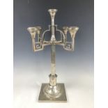 A Polish white-metal Secessionist period five-branch candelbrum, having a central inverted bell-form