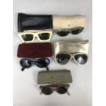 Vintage ladies' sunglasses, including two pairs of 1950s lucite framed cat's eye sunglasses, two
