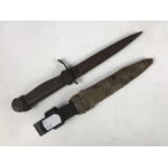 An Imperial German trench knife, the scabbard and hilt decorated with knot work