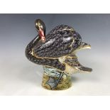 A Royal Crown Derby limited edition paperweight, Black Swan, 229/300, gold stopper, together with