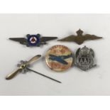 A group of aviation brooches and lapel badges including a mobile rotary aero engine pin