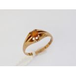 A late Victorian 18ct gold and citrine dress ring, having a single round-cut stone claw-set to the