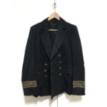 A Second World War Merchant Navy officer's reefer jacket, the tailor's label indicating the original