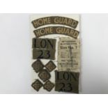 A card bearing cloth insignia and label removed from a 23rd Battalion London Home Guard officer's