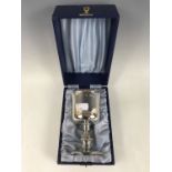 An Elizabeth II cased parcel-gilt silver chalice, having a Celtic style knopped stem and spreading