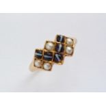A mid Victorian 18ct gold, seed pearl and black sardonyx cabochon dress ring, the latter being