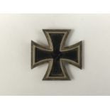 A Third Reich Iron Cross first class, the pin stamped 26