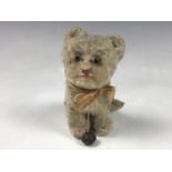 A vintage Steiff Susi kitten, having beige mohair, glass eyes and a bell, 11 cm