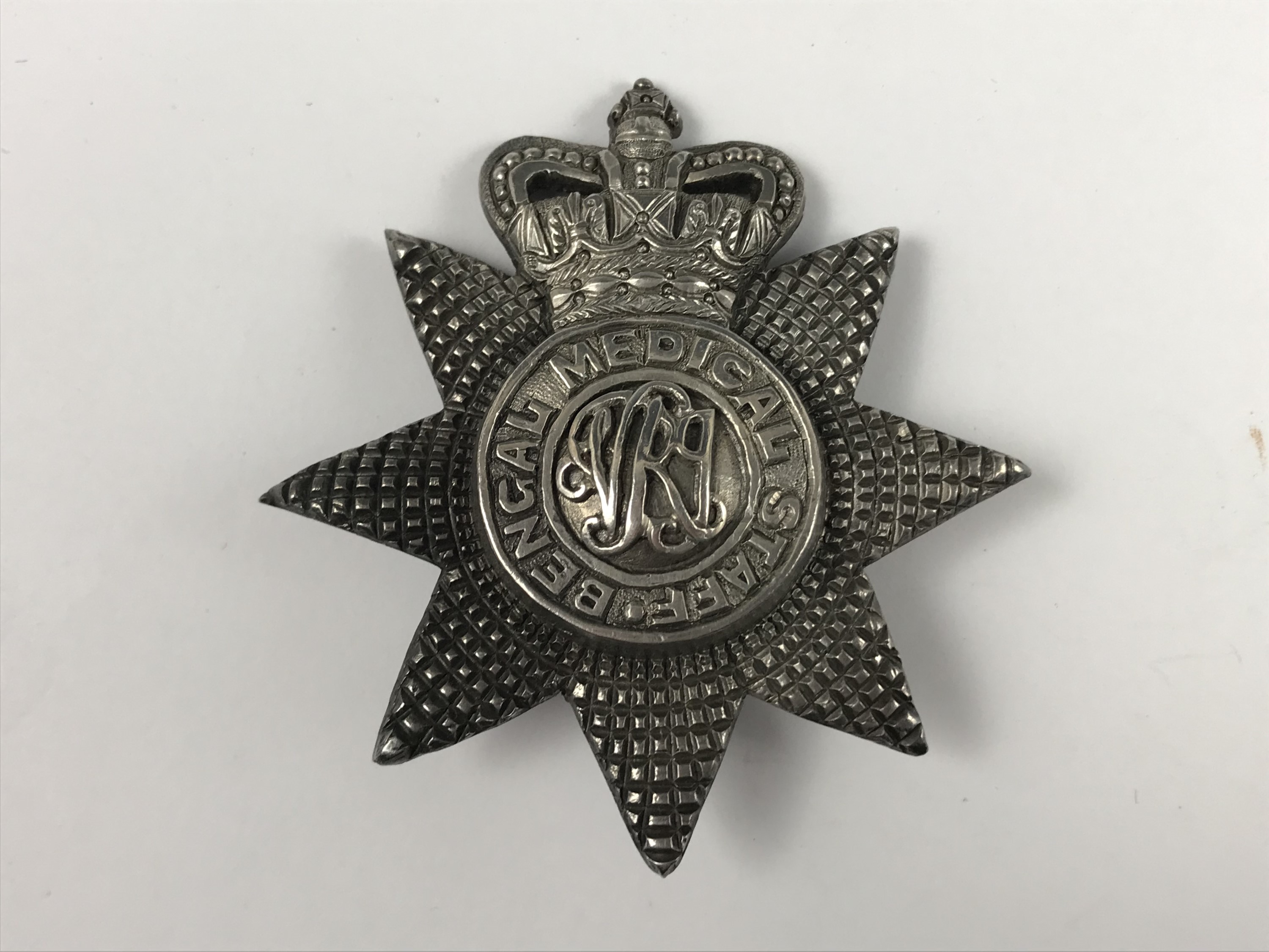 A Victorian Bengal Medical Staff white metal cap badge, (tested as silver), 66 x 63 mm