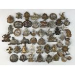 A quantity of infantry cap badges