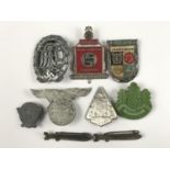 A German Third Reich DRL sports badge and a number of day badges