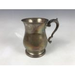 An Elizabeth II silver baluster-form tankard, having acanthus and scroll handle, Travis, Wilson &