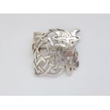 A Scottish silver brooch modelled in the form of a cow, of Celtic influenced design, with an open
