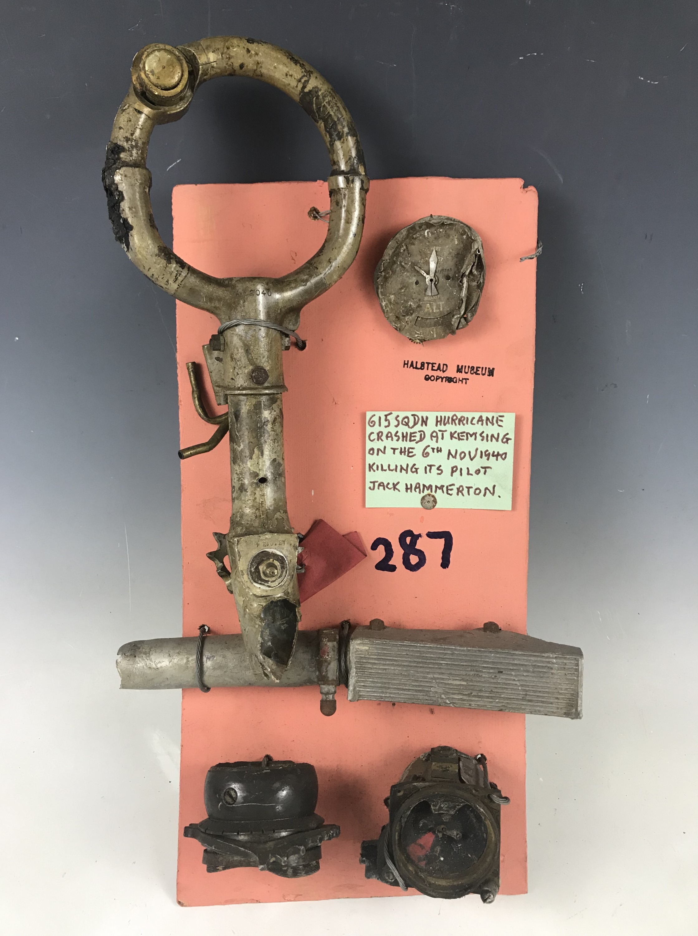 An aircraft control column and parts recovered from a 615 Squadron RAF Hurricane which crashed on