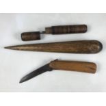 A 19th Century maritime large wooden fid, together with a clasp knife and needle case with