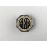 A Millom & Askham Hematite Iron Co Ltd ARP lapel badge