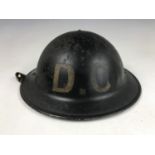 A Second World War Civil Defense Damage Control helmet