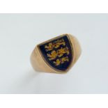 A gentleman's 9ct gold signet ring, the shield-shaped face inset with a black glass emblazoned