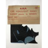 An unopened pack of Second World War ARP car headlight masks