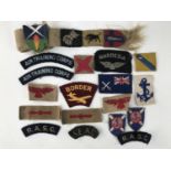 A small quantity of Second World War and later cloth insignia