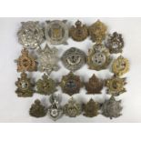 A quantity of Canadian cap badges