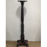 A late 19th / early 20th Century turned and carved mahogany torchere
