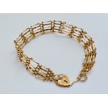 A 9ct gold gate-link bracelet with heart-shaped padlock clasp, 6.4g